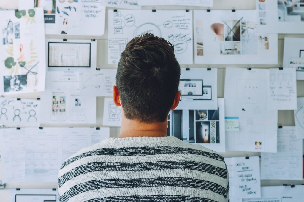 man-looking-at-task-board